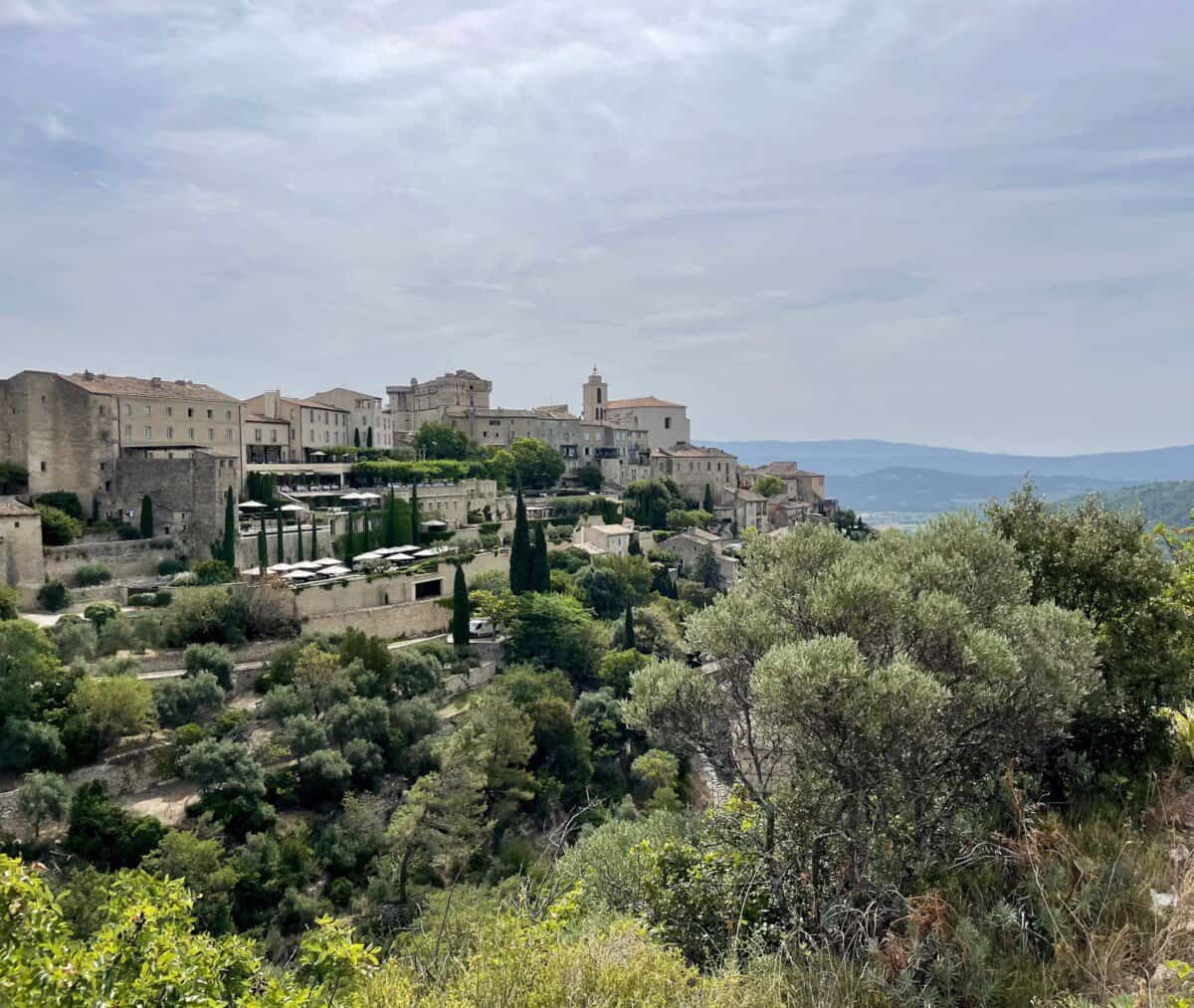 historic buildings on grassy cliff in Provence