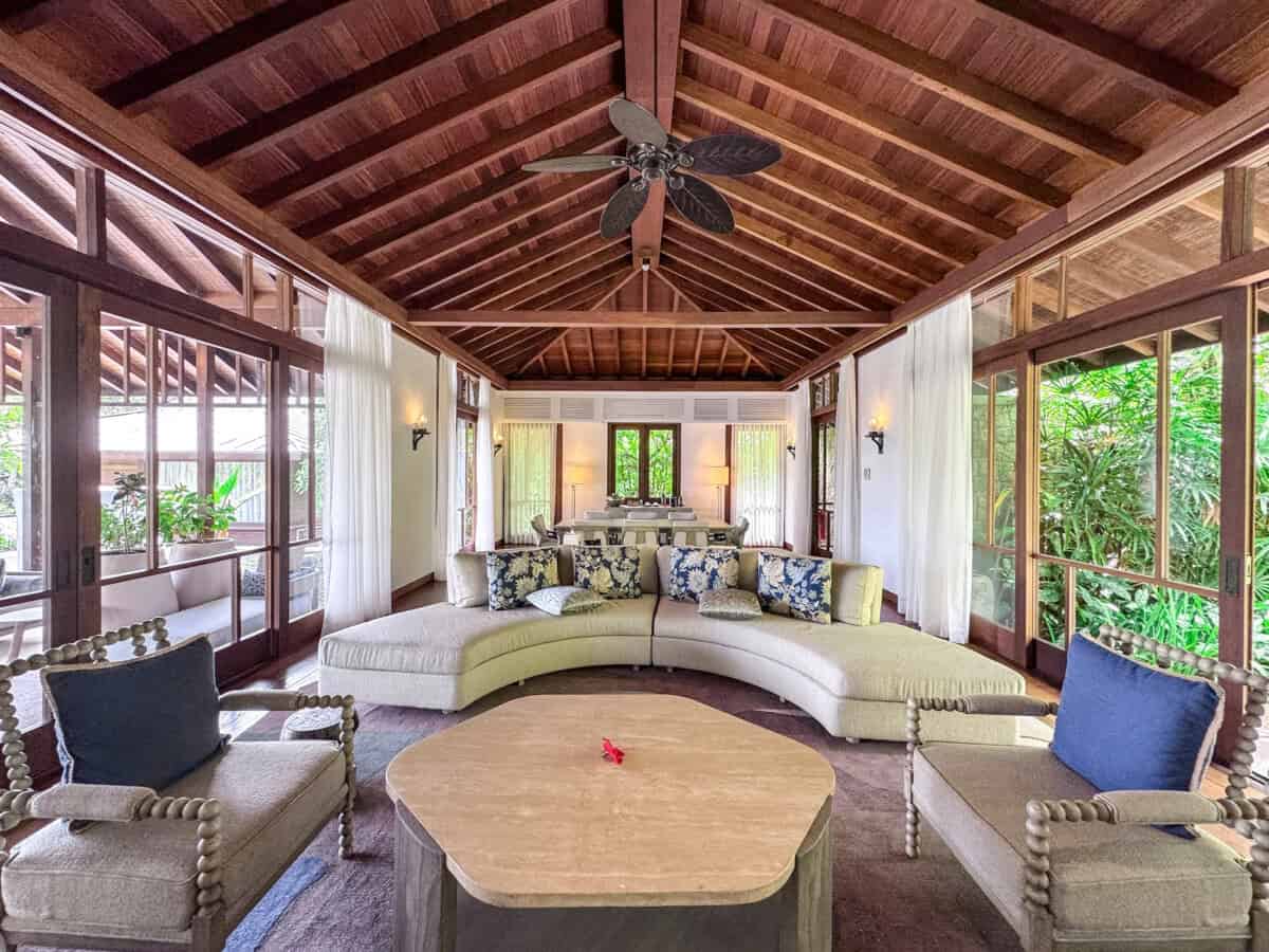 large living area with floor to ceiling windows and high ceilings at Four Seasons Seychelles Resorts