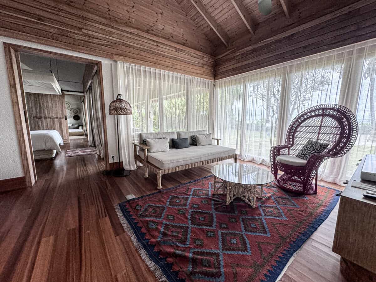 living area with decorative rug and seating area at Four Seasons Seychelles Resorts