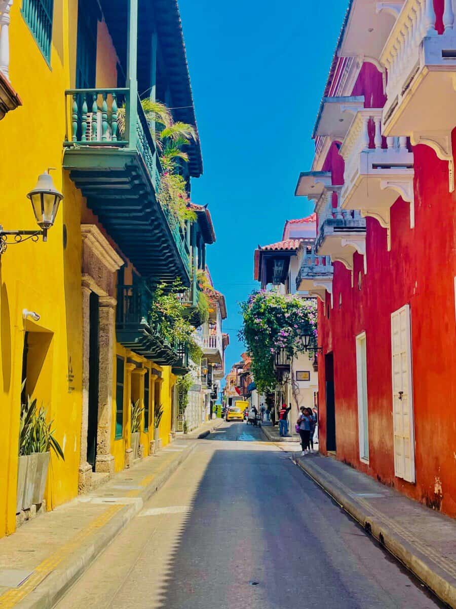 colorful alley with yellow and red buildings in Cartagena, Colombia