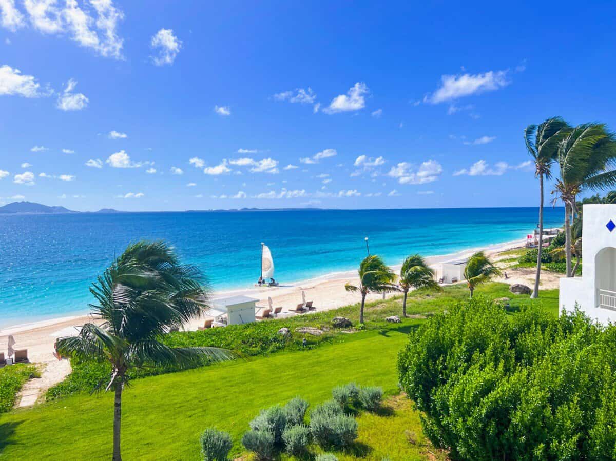 sailboat in the turquoise waters from Aurora Anguilla Resort & Golf Club 