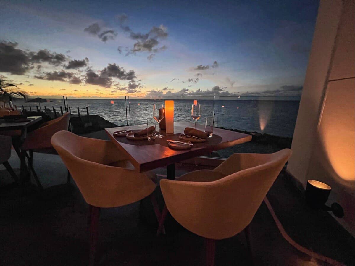 outdoor dining area with ocean views at Four Seasons Resort Anguilla