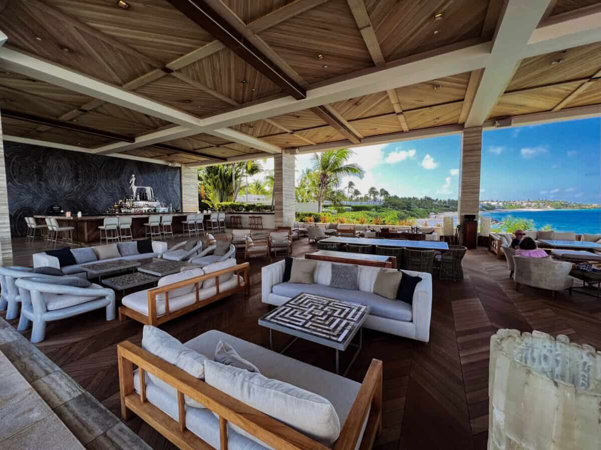 outdoor lounge space with seating at Four Seasons Resort Anguilla