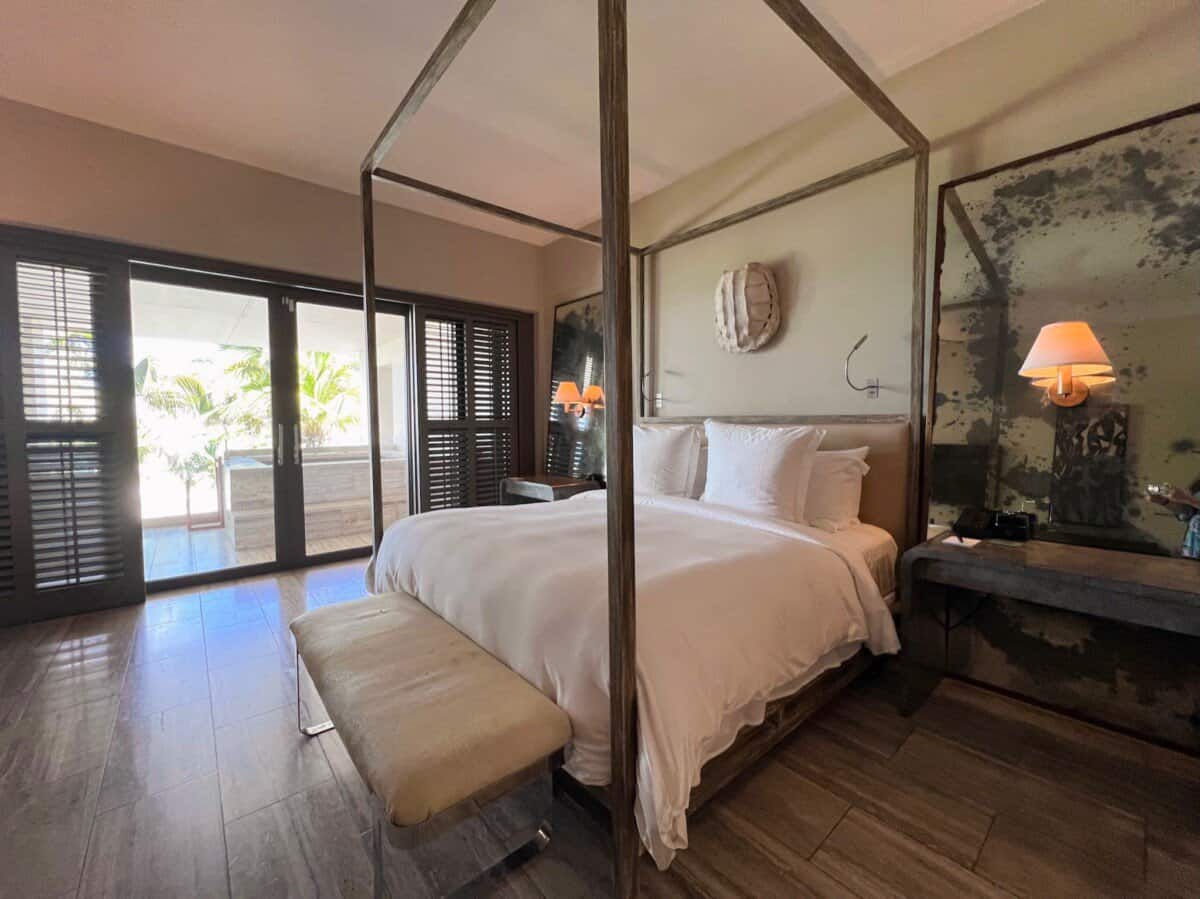 four poster bed in luxury room at Four Seasons Resort Anguilla