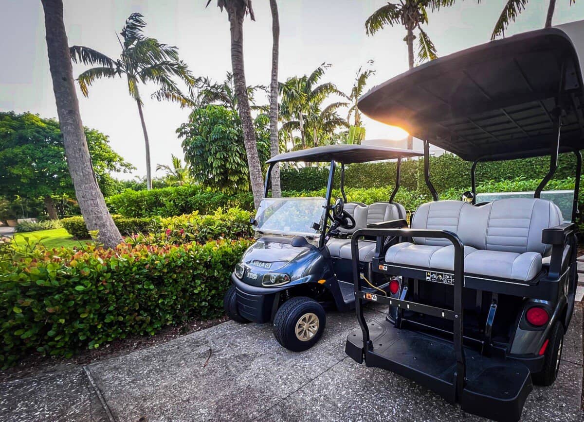 golf carts with palm trees in backdrop at Four Seasons Resort Anguilla