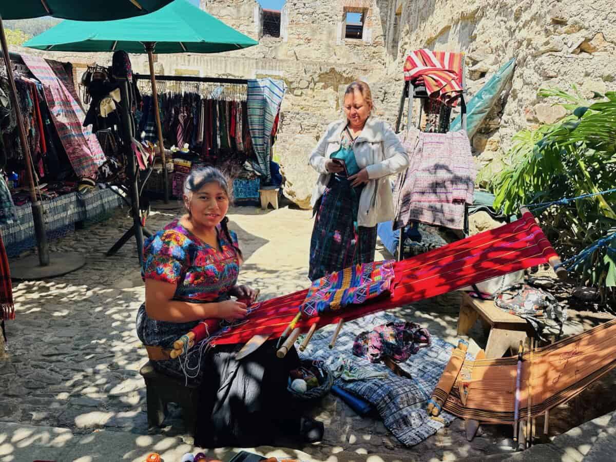 traditional craftswomen in colorful dress in Guatemala